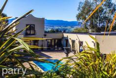 8 Ridgewood Ln Kings Meadows TAS 7249 Taking luxury to the next level this resort-style residence is more Beverly Hills than Kings Meadows! This home provides the complete package that you've been dreaming of and within such close proximity to the Launceston CBD. Comprising of a formal entry, tiled flooring, pillars and water feature; glass doors off entry opening to an impressive courtyard and pool. Free flowing living, kitchen and dining areas with glass bi-fold doors, the kitchen boasts granite bench tops heated flooring, gas appliances. Glass bi-fold doors feature off the dining, also leading to pool and paved courtyard. The ideal parents retreat upstairs, en-suite, plus balconies to enjoy expansive mountain and city views. 3 bedrooms off hallway, private with built-ins and access to pool and courtyard + fully self contained "Pool House", kitchen, lounge/rumpus, bathroom and bedroom. This home is an entertainers dream with an entertainment area for alfresco dining paved and undercover off the Pool House. All rooms are equipped for computer, TV, phone and ducted vacuum systems. There is a private home office with ample storage, a 3 car garage attached with remotes, hidden laundry and security systems. Luxury is everywhere with a saltwater pool, spa jets, solar heating, lighting, auto filtering, 12x9m approx shed, mezzanine floor, room for workshop, storage and toys. This grand home is expansively landscaped and driveways are equipped with stunning lighting systems.