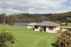 5090 Huon Highway Geeveston TAS 7116 Great Value With Priceless Views The renovations have just begun and this fantastic home is now available for you to make your mark. This wonderful home is situated on nearly 2 hectares of lush pastureland with views that will calm even the most highly strung and stressed person. From the oversized kitchen/dining area, you can simply sit and take in the tranquil water and mountain views. Or take a leisurely walk across the green pastures beside the dam, and just take in the serenity. The house features 4 double sized bedrooms, central lounge area and a large open plan kitchen and dining area. Recent renovations have revealed beautiful timber floors that are ready to be brought back to their former glory. The high ceilings create an added sense of space and light. There is a separate rumpus/sleepout that comes with its own pool table, great as a teenagers retreat or workshop for your latest hobby. With a little bit of work, you will have a magnificent home.