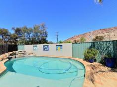 4/16 Bradshaw Drive Gillen NT 0870 With prime elevated views of Heavitree Gap as well as panoramic East and West MacDonnell Range views it will be hard to stop looking. This two bedroom first floor unit has all the trappings of the ground floor units without a private yard. There is still plenty of common area to enjoy a social BBQ, swim in the pool or just read a book in the resort style garden setting. The entire unit has vinyl flooring and ducted evaporative air throughout. Open plan living is the theme in the lounge, dining and kitchen areas while the bathroom has a bath, shower and toilet. A real bonus with this unit is a 12m x 6m insulated shed that has had a lot of detail added to the inside. Divided into sections to accommodate a garage, a storage area and a games room/studio it is still diverse enough to cater to an individuals specific needs. The grounds are immaculate and recent kerbing, bitumen & line marking make private off street parking a breeze. Priced to sell to either the astute investor or happy home owner.