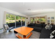 99 Springburn Dr Glass House Mountains QLD 4518 Your very own natural bushland setting, positioned on a huge 2872m2 block at the foothills of Mt Ngungun. This is the perfect spot to come home to after a busy day or raise the children in this peaceful safe environment. Upon inspection you will appreciate the upmarket quality and design features built into this beautiful family home. Presenting as new and offering 4 double bedrooms, ensuite , stunning caesor stone kitchen with gas cooktop, canopy rangehood, 900mm oven, glass splashback and a huge breakfast bench, large open plan living/dining areas and an oversized entertaining area with decking, fans and up close views of Mt Ngungun.