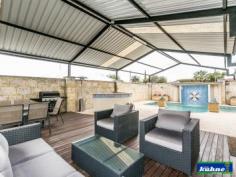 4 Kemp Pl Morley WA 6062 GRAND HOME OPEN SUNDAY 28th 12.00 to 12.45 A stunning home, designed and finished to the highest standard! This immaculately presented 4 bedroom, 2 bathroom home is full of all the (I wants). As you walk through the entry you will find yourself surrounded by beautiful ornate ceilings with quality fixings and furnishings throughout. The master bedroom with walk in robe has an ensuite which was designed way before it's time with floor to ceiling tiles and is very luxurious. The 2nd & 3rd bedrooms offer ample room and have built in robes. The 4th bedroom is currently being used as the entertainment room with built in cabinetry and block out blinds. The family bathroom also offers floor to ceiling tiles and is a modern master piece. As you enter in to the dining, kitchen and family areas which are open plan you look out over the stunning poolside retreat and patio areas, through glass sliding doors and windows that have all been furnished with ultra-chic roller blinds. The kitchen has been designed with a lot of thought for the astute cook and will simply take your breath away with its stone bench tops, top of the range appliances, dishwasher and design. This kitchen will be the envy of your friends. The reverse cycle ducted heating and cooling will keep you comfortable all year round as will the comfort of knowing the home is well secure with security doors and alarm system. As you step through the back sliding door under the huge gabled patio you will find yourself in your own little resort. The outdoor bar/ kitchen will be used year round as you sit back and watch the kids play in the heated sparkling pool in summer or the spa in winter or listening to the water features that surround the pool.