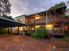 13 Toddy Pl Dunsborough WA 6281 BEACHY BROOME FEEL House - Property ID: 746139 Uniquely different & superbly located this stunning Old Dunsborough residence combines modern conveniences with Old World charm to create a truly magnificent property. Nestled securely in a quiet cul-de-sac your privacy is ensured whilst also enabling you to enjoy the beautiful ocean views on offer from both levels of this sprawling home. Upon entering the home via the extensive wrap around verandahs, you are immediately captured by the attention to detail that sets this home apart from the ordinary. On the lower level the Jarrah floors flow seamlessly from the 2 bedrooms located at the front, right through to the master bedroom at the rear of the home with powder room, ensuite & spa. The generous living area has direct access to the front verandah, perfect for relaxing & enjoying the quiet & leafy gardens whilst lazing in the heated spa. Upstairs the huge open plan design invites you into the main kitchen, living & dining area all climate controlled via the wood fire, gas fire & 2 reverse cycle air conditioners. Beautiful feature timber lined recessed ceilings, Jarrah flooring & windows complete the picture. The enormous country style kitchen with modern appliances & timber bench tops is the envy of any chef. A separated dining zone with ornate ceiling fan provides direct access & views out to the timber wrap around balcony & 180 degree ocean views beyond. The balcony sits amongst the treetops with plenty of space for outdoor entertaining. There is a 2nd large master bedroom also on this level with direct balcony access, bathroom & powder room for the guests enabling you to reside on either level. Externally there is a double carport, covered boat stand, plus an approximate 6x6m powered shed, brick paved driveway & paths with easy maintenance lawns & gardens. This custom built residence has been lovingly created by the current owners to make the most of its desirable Coastal location just minutes to the Beach & Town Centre. Print Brochure Email Alerts Features Land Size Approx. - 896 m2 Built-In Wardrobes Close to Schools Close to Shops Close to Transport Fireplace(s)