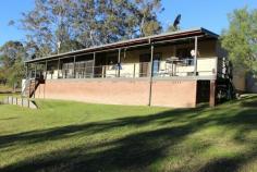 2441 Bucketts Rd Gloucester NSW 2422 5 Bedroom home on 3 acres only 20 minutes east of Gloucester on the Bucketts Way. Immaculate presentation throughout this home which is surrounded by neat gardens and views to the creek and bush at the back of the property. Plenty of sheds, lots of rainwater, easy access and a convenient location make this a great package. The home features a well appointed kitchen, 2 living areas, 2 bathrooms, 2 air conditioners, a wood fire, a full length verandah and a screened sunroom.