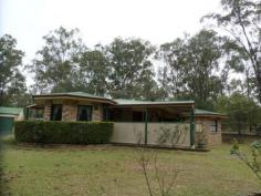 1 Laurette Drive Glenore Grove Qld 4342 This corner block is 1.09 ha of gently sloping, lightly timbered land with a small dam . The 4 bedroom brick home includes main bedroom with walk in wardrobe and ensuite, two of the other bedrooms have built in robes and ceiling fans with the last bedroom being smaller with built in robe. Open plan kitchen has pantry, cooktop and wall oven with plenty of bench space. Living area is carpeted and has a ceiling fan and air conditioner for comfortable living and entertaining. There is a large four bay brick garage with roller doors and cement floor with power supplied. In addition to town water connected, the property has 2 rainwater tanks and a electric pressure pump.