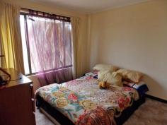 7/4 Aneura Pl Sadadeen NT 0870 Situated in the Sadadeen area close to schools, shops and transport is this end three level townhouse. The unit is almost at the top of the block with fabulous views of the surrounding areas and MacDonnel Ranges. Entry is to the front verandah which can double as a 2nd outdoor living area. The lounge area is tiled, boasts a reverse cycle air conditioner and has a handy storage area under the stairwell. The spacious second level area is tiled with the kitchen having electric cooking, dishwasher and ample cupboard and bench top space. The internal laundry is on this level as well and also a second toilet. Up the stairs to the top level you will find two bedrooms both with carpet and built in wardrobes. The main bathroom has shower over bath, vanity and toilet inclusive. Your private courtyard is paved and has a lovely shaded timber pergola and there is a side gate that allows you access to your unit from the side.
