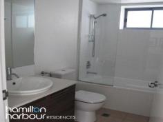 10701 8 Harbour Rd HAMILTON Qld 4007 This spacious 2 bedroom, seventh floor apartment overlooking Hamilton and Eagle Farm Race Track really does have it all. This floor plan has a beautiful open plan layout with large living and dining area that is accentuated by the double glazed floor to ceiling doors embracing the morning sun. The modern kitchen is equipped with European appliances - gas cook top, electric oven and dishwasher plus plenty of bench and cupboard space has direct access to the balcony making it perfect for dining and entertaining with ease. The master bedroom has a separate ensuite, with the second bedroom boasting views up the Brisbane River. Both of which are queen sized. The laundry is cleverly hidden behind closed doors and the main bathroom includes a bath tub for complete relaxation. This is a Pet friendly complex. Located in the hub of the Hamilton Harbour Precinct and 3 minutes walk to Racecourse Rd Village, Brett's Wharf and Portside, you will be in the centre of all the local dining, entertainment, shopping, medical and community services. Close to a variety of public transport options including the BCC City-cat and ferries, trains, bus stops, airports and arterial roads, going places is a breeze.