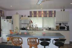 Tivoli QLD 4305 This delightful mobile home has been lovingly cared for by the current owners and is now presented for sale. Here is an opportunity to secure your little piece of paradise located on a prime site at the Ipswich Caravan Village. There are no age limits here - anyone can take advantage of this opportunity to secure your future and live in this idyllic setting. The site is located on the eastern edge of the village offering unobstructed views to the east through the trees. The current site includes the relocatable home, a double carport, separate laundry shed, garden shed, established gardens and views. Being located near the top of Tivoli hill - this property is flood free. * Well maintained fully insulated Ranger Relocated Home * Two bedrooms with fans & ample built-in robes/storage * Master bedroom with aircon, fan and additional walkin robe * Separate study with fan, built-in cupboards/shelving * Modern galley kitchen with gas cooking and breakfast bar * Spacious open plan living / dining with aircon * Two way bathroom with storage cupboard * Private front east facing deck with views & shade/privacy blinds * Two car carport / entertaining area plus garden shed * Current site agreement includes 700sqm of land