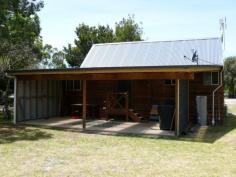12 Eighth Ave Raymond Island VIC 3880 CUTE COTTAGE ON RAYMOND ISLANDCharming timber cottage on large allotment situated close to the lake. The main home comprises open plan living with high ceiling, split system, three bedrooms, (third bedroom is a loft bedroom), bathroom and laundry. Large undercover alfresco area for outdoor living and BBQ. There is also a shed which has been lined and includes a shower and toilet, perfect for guest accommodation. Fantastic holiday home.
