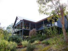 10 Denny Road Nannup WA 6275 Inspection by Appointment FLY IN, CHILL OUT Expansive living with a merging of the external and internal is what you get from this architect designed modern, spacious and airy home on a five and a half acre natural bush block in gorgeous Jalbarragup, approximately 25 km from the Nannup town centre. If you have ever wanted an elevated home with indoor/outdoor areas to take in the stunning bush views, a winter creek encircling your borders, backing onto Blackwood River reserve and the state forest to three sides of you then this home would fit the bill. Stunning, lofty living areas with wall to wall fold back doors onto the completely covered 55 sqare metres of deck protected from the weather for all year round use. Master suite with sliding doors onto veranda, huge corner bath and walk in robe. Two well appointed guest bedrooms with sliding doors on to the veranda and a good sized study/4th bedroom. Huge, high well defined internal spaces, sheds and caravan parking and two large rainwater tanks. Jalbarragup is approximately 25 km from Nannup (20 minutes’ drive) and easily accessed from Busselton via Jalbarragup Road (approximately 45 minutes’ drive) or from Margaret River (approximately 1 hour) by way of the Brockman Highway. When Mowen Road is re-opened and then sealed, driving time to and from Margaret River will be reduced to around 45 minutes. This ease of access makes the location ideal for FIFO workers looking for a quiet getaway – Busselton Regional Airport is only three quarters of an hour away.