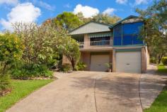 1 Churinga Pl Coffs Harbour NSW 2450 Located in a quiet cul-de-sac, this attractive blonde brick property enjoys a leafy, tranquil aspect. With plenty of visiting birdlife, it's hard to believe it's just a few minutes drive from here into the CBD. A much sought-after location tightly-held by great neighbours, you can count the number of homes on one hand. Set back from the street on a generous 1353sqm block, with a lovely front garden affording privacy, the home has two garages, along with the bonus of under-house storage and a workshop area. While there's also plenty of additional off-street parking, a big plus is the concrete side driveway leading to the covered carport at the rear - perfect to store the boat or extra vehicles. And behind this section is a garden and even more land: there's potential to retain the double garage for the main house and use the separate carport as a garage for a possible second building (subject to Council approval). Side stairs lead to a wide, tiled wrap-around verandah, the perfect late afternoon spot to enjoy the views with a glass of wine and cheese platter. Tastefully renovated interiors which maintain the warmth and character of the home add to the appeal of the open plan living and dining room, which has lovely timber flooring and air conditioning. The adjoining sunroom is accessed through French doors, and windows on three sides offer the perfect location to sit back and relax with a book or magazine. Slate-look flooring in the kitchen is soft underfoot, and this entire space has had a contemporary renovation by Hi-Tech Kitchens just nine months ago. Streamlined and practical, with plenty of cupboard and bench space, the kitchen features a double pantry, integrated Electrolux microwave and oven and a ceramic cook top. A Euro dishwasher is another addition here. With a practical and spacious floor plan, all three bedrooms run off a long hallway, with double linen storage and a hide-away laundry behind cupboard doors at the far end. The master bedroom features big windows, mirrored robes and a modern ensuite with a crisp white colour scheme. Both this room and the second bedroom have soft carpet underfoot, while the third bedroom has timber floorboards. The generous main bathroom has a large frosted window that allows light to flood into the space without compromising privacy, and it also incorporates a freestanding vanity. The hall flows out to another fabulous spot for entertaining, with a sun-drenched outdoor area with a generous curved seating area. Throw down an assortment of chair pads here and you'll have plenty of room for your guests or extended family to enjoy the elevated rear garden. This is a beautiful spot to enjoy the warm winter sun, or pop up an umbrella in summer for your afternoon barbecue. Beyond the carport is a quiet garden with established azaleas, frangipani, bottlebrush and palms, all which add to the tranquil feeling of the property as well as offering privacy. Tastefully renovated, practical, with a large block, double garaging plus side access and a carport, this property is beautifully presented and has great overall appeal. Throw in the fact that it's just a couple of minutes to the CBD by car (with the option of strolling into town) and this lovely home is hard to beat. *Renovated, private home with lovely views. *Two garages + concrete side driveway to separate carport. *Contemporary new kitchen, timber floorboards, lovely sunroom. *Quiet cul-de-sac location close to town. www.unre.com.au/chu1 Follow us on Twitter: Unrealonline RATES: $2440.49 LAND SIZE: 1353 sqm Whilst every care has been taken in respect of the information contained herein no warranty is given as to the accuracy and prospective purchasers should rely on their own enquiries.