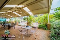 58 Dean Rd Jandakot WA 6164 PACK THE GOLF CLUBS....BRING THE FAMILY TOO! Web property id: TRE150 You're invited to our HOME OPEN this coming SUNDAY from 12:00-12:40PM. This quality Ross North built double brick and tile home on a huge 717sqm block backing onto the fairway is the ultimate residence for the active family, and if you’re a golf aficionado you’ll be in seventh heaven! Complete with four large bedrooms, three bathrooms, formal lounge and dining, spacious open plan family/living and games, generous sized kitchen, children’s activity/study, big gabled alfresco entertaining patio, double lock up garage with rear roller door and garden shed on a fully fenced block with delightful established gardens including a variety of fruit trees; this is a very inviting home in a tightly held location. With 258sqm of living space, it truly is a substantial sized home, and additional features which enhance comfort and appeal include: cosy gas log fireplace, ducted evaporative air-conditioning, gas storage hot water system, tiled floors throughout for easy maintenance and a wonderful floor plan to facilitate separation of living – this is a home built to accommodate the needs of the modern family. An open plan kitchen with abundant storage, stainless steel appliances including 900mm gas oven and cook top, range hood, dishwasher and tiled splashback is a very functional design and there is ample room for a few helpers to assist without getting under the feet of the chef! Whilst there is so much living and entertaining space inside the home – it’s the huge covered alfresco patio that will attract visitors and is the perfect platform for all social occasions. As inviting as this home is throughout, it is equally lovely outside, framed by established vegetation with a large shady tree in front yard, plenty of room for a pool, the privacy of no neighbours at the rear and you can eat from your garden – avocadoes, mangoes, lemons, limes, plums and grapes! With a fully reticulated water system, maintenance is minimal...the hard work’s been done; you can just enjoy the fruits of someone else’s labour! Located in the ever popular and highly sought after Glen Iris Golf Course Estate, this is a quiet, safe, family-friendly neighbourhood close to all amenities including: Kwinana Freeway, Roe Highway, the new Fiona Stanley Hospital, shops and public transport. The golf course, clubhouse and Iris Restaurant are all at your doorstep...literally. It’s not too late to be in your new home prior to Christmas – enormous value on offer; act immediately. Proudly Marketed by THRIVE Real Estate with Derick & Bev PITT - We're Living & Selling on this Fabulous estate.