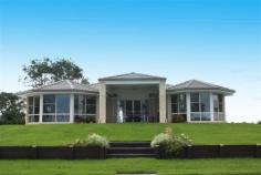 23 River Road East Harwood NSW 2465 Property Description Harwood Haven We all know when looking for a property to call your own you should look for presentation, position and price. From the moment you arrive to inspect this impressive riverfront family home you know you’ve got all this and so much more. This home is a true delight with outstanding presentation inside and out and taking in the amazing Clarence river views. Boasting a family friendly design you can’t help but be impressed by the separate formal living and dining areas as well as the open plan tiled meals and family rooms, all of which are light and spacious. The modern kitchen is fully equipped with loads of cupboard and bench space and even includes a dishwasher. All four bedrooms are generous in size and the master bedroom comes with its own walk in robe and ensuite. A handy 5th room come home office/craft area is also on offer. Fitted out with ample cupboard space for storage and a generous area for the family computer and desk or your latest challenge to be worked on this versatile room makes family living that much easier. If you love entertaining family and friends in style then you will be delighted with the waterfront under roof patio area that opens up from the family room. You’ll have no worries about where to store the family tinny or trailer as in addition to the extra-large remote double garage there is generous side access onto the large concrete pad. Property Features Land Area 1,016.0 sqm