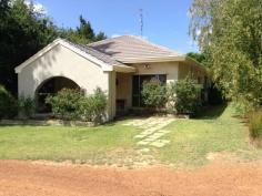 53 Hackett Road Donnybrook WA 6239 5 acres, 2 homes, large shed, income. Located 3kms to the south east of Donnybrook and within the town boundary, this 5 acre rural zoned property includes 2 homes, an 18m x 12m shed with 3 phase power, garden shed/storeroom, tanks & equipped bore, and income producing plantings of orchard and protea's. The well presented rendered brick and tiled roof main home features 4 good sized bedrooms, lounge, kitchen (timber feature cupboards), dining with reverse cycle air conditioner, entry hall, main bathroom, shower and toilet off the laundry, polished jarrah floorboards throughout much of the home and solar hot water system. The home, with attached patio and front porch, is set in established gardens that provide it with some privacy from an insulated 4-5 year old second home. This insulated home, built of timber stud framing, rendered compressed cement wall cladding, iron roof sheeting and concrete floors, features 3 good size bedrooms. Each bedroom has tiled floors, built in robes, vertical blinds, with an ensuite to the main bedroom, while open plan kitchen, dining and lounge have vinyl floor covering, vertical blinds and reverse cycle air conditioning. The main bathroom includes a toilet. General Features Property Type: Lifestyle Bedrooms: 7 Bathrooms: 3 Land Size: 2.02ha (5.00 acres) (approx) Outdoor Features Carport Spaces: 1 Garage Spaces: 3