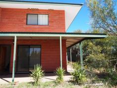 4/5 Aneura Pl Sadadeen NT 0870 This unit is too good to pass up with the First Home Buyer Grant coming to an end in December 2014. Get in before the end of the year to get your $25,000 grant! You will feel the benefit in your back pocket of a privately managed body corporate. With this you are essentially just paying the raw costs of water and insurance and none of the other costs that come with a managed unit complex. Positioned at the back of the complex and sitting on a hill, this great two bedroom townhouse is worth a look for both its great design and great views! The open plan tiled living/dining and kitchen boasts ducted evaporative air conditioning throughout and ceiling fan. Downstairs the internal laundry also has an extra toilet. The kitchen features gas cooktop and oven, plenty of cupboard and bench top space and sliding door that leads out to the backyard. Upstairs the main spacious bedroom boast ceiling fan, built in robes, carpet and large private balcony with fabulous views of the Ranges. The other bedroom also features ceiling fan, split air con, built in robes and carpet. The central bathroom has bath over shower, vanity and toilet inclusive. Outside, the veranda runs along the front and continues around the side so there is plenty of choice of where to sit and enjoy the outdoors. There's enough room for a vege patch too. The unit features a single car spot with plenty of other parking spots and the benefit of a privately managed body corporate which will help keep your costs down! Call for a viewing today!