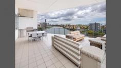 50/98 Thorn St Kangaroo Point QLD 4169 Spacious Penthouse Enjoy the benefits of a house sized property with the convenience of apartment living and special location. Perfect North east aspect to showcase expansive water, Story Bridge, CBD and park views. -Modern lines with soaring ceilings and unique architectural elements. -465m2 on title -Wrap around balcony -Private lift access -Ultra quiet serene inner city location. -Fully ducted and zoned air conditioning -3 side by side parks -Ample storage in basement with 3 storage lockers in secured basement -Separate family sized laundry -Motorised blinds and curtains. Open plan entertainers kitchen features stone bench tops, Miele appliances with built in coffee machine and temperature controlled wine storage cellar facility. Front balcony flows seamlessly from formal lounge and is suitable for large scale entertaining and features built in BBQ kitchen with sink and commercial smoke extraction. Master bedroom features curtain glass walls to take advantage of stunning view. Walk in wardrobe is large enough for all your clothes. Ensuite is fitted out with bath, stone tops and polished tiles. Adjoining separate study also enjoys panoramic water views. A separate wing houses the very large 2nd and 3rd bedrooms, guest bathroom and laundry. Exclusive complex features pool, spa, gym and top class management. Airport tunnel entrance point is a convenient 100m drive and there are no traffic lights to the CBD. Stroll along the waterfront boardwalk to Mowbray Park which has a city cat stop and is across the road from restaurants, cafes and shopping. Call Justin Smith on 0438143691 to view today.