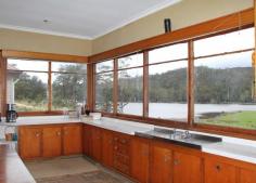 5090 Huon Highway Geeveston TAS 7116 Great Value With Priceless Views The renovations have just begun and this fantastic home is now available for you to make your mark. This wonderful home is situated on nearly 2 hectares of lush pastureland with views that will calm even the most highly strung and stressed person. From the oversized kitchen/dining area, you can simply sit and take in the tranquil water and mountain views. Or take a leisurely walk across the green pastures beside the dam, and just take in the serenity. The house features 4 double sized bedrooms, central lounge area and a large open plan kitchen and dining area. Recent renovations have revealed beautiful timber floors that are ready to be brought back to their former glory. The high ceilings create an added sense of space and light. There is a separate rumpus/sleepout that comes with its own pool table, great as a teenagers retreat or workshop for your latest hobby. With a little bit of work, you will have a magnificent home.