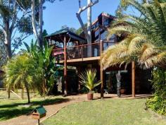 40 Koonwarra Dr Hawks Nest NSW 2324 Property Details Price $990,000 State NSW Region Port Stephens Suburb Hawks Nest Postcode 2324 Property Type House Bedrooms 4 Bathrooms 2 Carspaces 1 Land Size 556 Square Metres Perfectly situated to capture wonderful views. A stones throw to the waters edge and overlooking on the huge nature reserve, the ultimate carefree lifestyle. You can almost touch the water from this thoughtfully designed riverside home. The views are just lovely from nearly every angle of this home. Open planning of the home allows for easy entertaining, spilling outdoors to the front deck with magic views. Soaring cathedral ceilings and expansive use of glass on the upper level capture the bay and Myall River views. Stand by the sandstone fireplace, in the well appointed kitchen or spacious dining area and you’ll enjoy the stunning vistas. The top storey comprises two bedrooms, with the oversized master suite overlooking the waterfront with its very own private balcony, spacious walk in robe and huge ensuite complete with sunken spa bath , open plan lounge and dining, modern kitchen are finished in beautiful timber . The front deck is perfect for entertaining and taking in the views. Downstairs features the 3rd and fourth bedroom complete with second living room, again with water views. The sheltered patio completes the picture, with room for every one to enjoy this fabulous location. The carpentry of the exposed timber work is of cabinetmaker standard. The selection of timbers is complimented by the extraordinary workmanship. The home captures the northerly breezes and fabulous water views. Built in western red cedar it is surrounded by gum trees and tropical gardens which are irrigated by bore water. Inspection is a must!!! "We have obtained all information in this document from sources we believe to be reliable; however, we cannot guarantee its accuracy. Prospective purchasers are advised to carry out their own investigations…"