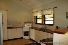 Malanda, QLD 4885 Consider this modern, elegant four-bedroom home on 1 hectare (2.5 acres) in a select area close to Malanda. This neatly presented brick veneer home is surrounded by sweeping tracts of lawn, established retained gardens and is framed by a rainforest backdrop. A bitumen driveway from the front gate to the house and two-bay shed keeps maintenance and mess during the wet weather to an absolute minimum. The kitchen with good storage including pantry and a stunning feature timber bench-top overlooks the verandah; the ideal spot for al fresco dining to enjoy the manicured surrounds. Practical tiles cover all living and wet areas with bedrooms having the added comfort of carpeted floors. The property is on town water but also has rainwater supply. There’s not a thing out of place here; beautifully presented, conveniently located – inspect today and make an offer! 1 Ha (2.5 acres) 4 brms; 4 built in Brick veneer Lowset; steel framed 1 bathroom 2 Verandahs Fenced Gas HW Ceiling fans 2 bay shed Garden shed Town water Rainwater Veg garden