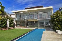 2 Loch Maree Pl Vaucluse NSW 2030 Secluded in a serene cul-de-sac on a l 936sqm (approx) parcel of
absolute waterfront land, this dramatic architecturally designed
residence is three quarters complete and awaits a buyer to add their own
finishing touches.
Showcasing clean, contemporary lines and generous spaces, it features
the extensive use of glass to maximise the breathtaking vista. It
contains four bedrooms and 5.5 bathrooms, including a whole-floor master
suite, along with a fifth bedroom/nanny's quarters if desired.
Expansive open-plan entertaining space flows to a level garden complete
with an infinity edge pool from which you can soak up the view. It steps
down to a prized boathouse with a slipway, a private jetty and a sandy
beach at low tide. Additional luxuries include a five-car garage, lift
access to all levels and a gas fire.
Enjoying one of the East's most coveted addresses, just footsteps to
Vaucluse Park, it presents a rare chance to make your mark on an
aspirational contemporary residence