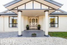 32 Vrouka Place HADSPEN TAS 32 Vrouka Place is located in the small township of Hadspen only 9 minutes commute to Launceston's CBD. At the end of a quiet cul-de-sac you will enter a long internal drive and arrive at this grand residence. The house is perched on the side of the hill accessing full views of the South Esk River. The home sits on 7683 square meters of land with side access down to the river where there are numerous walking tracks. This large family home is approximately 36 square meters and is constructed with a brick render finish, inside there are 4 good-sized bedrooms all with built in wardrobes. The master bedroom features a huge walk in robe and a luxury corner spa in the en-suite. There is plenty of room at both the front and rear of the property, if you're using the rear of the property it could be great for a large family pet such as a horse or some sheep. There is already a double garage with internal access, however if you are looking to expand this storage space, the front of the property has great potential for further garages or sheds. With its timeless elegance, this home flows seamlessly through multiple living areas, great for separating the kids while the parents entertain. The kitchen is situated at the hub of the home with granite bench tops and surrounded by polished timber floorboards that flow through to the dining and lounge areas.