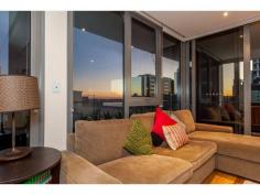 21/155 Adelaide Terrace East Perth WA 6004 TWILIGHT OPEN, 5.30 -6pm, Wed, 24th PRICE SLASHED! LAST CHANCE or OWNER WILL LEASE! Stunningly situated on Level 10 of the ultra-modern “Rise” complex, this immaculate two-bedroom two-bathroom apartment defines easy inner-city living and enjoys peace, tranquility and security whilst boasting breathtaking river and city views from a massive wrap around 40sqm balcony and within. Polished Blackbutt timber floorboards lend a low-maintenance feel throughout the home and creates a smooth flow, linking the sleeping wing to the open-plan living and dining area where a spacious kitchen is incorporated into the airy design. The main living zone and both bedrooms each have their own individually-controlled split-system air-conditioners, including a sumptuous master ensemble with mirrored built-in wardrobes, access out on to the balcony for entertaining and a private and stylish ensuite bathroom with a shower, toilet and twin stone vanities. The Guest bathroom-come-laundry services guests and the Guest bedroom that also provides balcony access, whilst the kitchen is luxuriously-equipped with a sparkling stone island bench top, quality glass splashbacks, a Bosch electric cook top, oven, exhaust and a Miele dishwasher. Absorb the sun glistening or the night city lights reflecting on our picturesque Swan River and choose to either nest or invest in this East Perth gem, just footsteps from convenience stores, cafes, Langley Park and more. With free buses along St George’s Terrace, this is your gateway to our vibrant CBD! Other features include: • 2 bedrooms, 2 bathrooms * Level 10 * Very generous 89sqm of internal living with separate sleeping wing • Shower, toilet, twin stone vanities and laundry appliances in Guest bathroom • L-shaped alfresco balcony for entertaining and quiet contemplation whilst indulging in mesmerising views of our beautiful Swan River and its city surrounds • Audio intercom system, secure lift access from Grand Lobby entrance • Feature down lighting • Quality blind fittings throughout • Shadow line cornices • Moments from Perth train station, free city CAT buses, cafes, restaurants and shopping * Resort facilities include a resident’s lounge/function room, a shimmering infinity-style lap swimming pool, sauna, spa and gym – and there is also one secure car parking bay plus storage available. * Anticipated Rental Return $750 per week Invest in the East Perth precinct now before more than $3.5 billion worth of infrastructure is completed, including the new Waterbank project located only two blocks from 175 Hay Street, as well as the new Perth City Link, Elizabeth Quay, Perth Light Rail System (MAX), the new Pedestrian Bridge pass to Crown Casino and much more OUTGOINGS: Water Raters: $1,155 per annum Council Rates: $1,502 per annum Call Melissa Green on 0437 702 708 today to arrange your viewing Area: 90 Sqrs Land:: 144 Sqms Features larger balcony • ample storage • polished floorboards • 3x AC units • Ensuite • Outside Spa • Remote Garage • Swimming/Lap Pool • Intercom • Gym • Polished Timber Floors • Dishwasher • Courtyard • Built-ins • Balcony • Air Conditioning •
