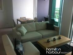 12104 8 Harbour Rd HAMILTON Qld 4007 This beautiful modern two bedroom apartment could be yours. This apartment is light, airy and embraces the vast views of Hamilton, Ascot and out as far as Moreton Bay through the double glazed floor to ceiling windows. The fully carpeted open plan living area embraces a large linear styled kitchen with quality Omega appliances. The master bedroom features an ensuite, the second bedroom features floor to ceiling windows, built in robe. With all of these features it is a rare find and will not last. This apartment also comes with 2 car parking spaces and use of all the Hamilton Harbour facilities including the beautiful resort style lap pool and BBQ area surrounded by lush tropical gardens.