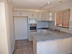 4/5 Aneura Pl Sadadeen NT 0870 This unit is too good to pass up with the First Home Buyer Grant coming to an end in December 2014. Get in before the end of the year to get your $25,000 grant! You will feel the benefit in your back pocket of a privately managed body corporate. With this you are essentially just paying the raw costs of water and insurance and none of the other costs that come with a managed unit complex. Positioned at the back of the complex and sitting on a hill, this great two bedroom townhouse is worth a look for both its great design and great views! The open plan tiled living/dining and kitchen boasts ducted evaporative air conditioning throughout and ceiling fan. Downstairs the internal laundry also has an extra toilet. The kitchen features gas cooktop and oven, plenty of cupboard and bench top space and sliding door that leads out to the backyard. Upstairs the main spacious bedroom boast ceiling fan, built in robes, carpet and large private balcony with fabulous views of the Ranges. The other bedroom also features ceiling fan, split air con, built in robes and carpet. The central bathroom has bath over shower, vanity and toilet inclusive. Outside, the veranda runs along the front and continues around the side so there is plenty of choice of where to sit and enjoy the outdoors. There's enough room for a vege patch too. The unit features a single car spot with plenty of other parking spots and the benefit of a privately managed body corporate which will help keep your costs down! Call for a viewing today!