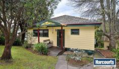 5 Nevada Avenue Tecoma VIC 3160 From the moment you step inside you will be charmed by this delightful, much loved and well maintained north facing 1950's character "Hills Home" which has been a family home to the current owners for over 40 years. Light bright living incorporates a country style kitchen, cosy lounge with open fire place, dining area with doors leading out to a large undercover entertainment deck where you can relax or entertain with family and friends while enjoying the outlook over the ¼ acre of established gardens and the leafy aspect over the hills. Also on offer upstairs are 2 charming bedrooms, bathroom, and all the features of that era with high ceilings, picture rails, sash windows and ornate cornices. Downstairs is a 3rd bedroom with WIR's, bathroom and living area. - See more at: http://essential.harcourts.com.au/Property/579873/VTC4925/5-Nevada-Avenue#sthash.cl1nZedK.dpuf