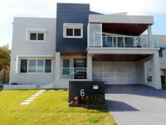 6 Ebsworth St Redhead NSW 2290 From the moment you step inside this lovely residence you will instinctively feel special and pampered. Everything that has been done here is to ensure that you and your family love the experience of living in this wonderful position. Lots of winter sunlight and summer coastal breezes and only 150 metres or so to the beach. Vistas down the coast to Swansea Heads. Expansive open plan living areas opening to the view deck and private rear courtyard leading up to the secluded pool and poolside entertaining area. Upper level features a very large master suite incorporating a well laid out home office and very large ensuite bathroom plus 2 guest bedrooms and the main bathroom. On the lower level is the 4th bedroom, 3rd bathroom, rumpus/retreat, gym room and generous double garage. Provision has been made for a lift to be installed if required and nothing has been left to the imagination. We're very happy to be representing the owners in the sale of this beautiful home. (We have obtained all information in this document from sources we believe to be reliable; however, we cannot guarantee its accuracy. Prospective purchasers are advised to carry out their own investigations.) Property Features Built-In Wardrobes • Garden • Polished Timber Floor • Secure Parking • Swimming/Lap Pool • Terrace/Balcony • Website Featured Property •