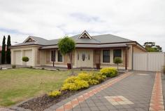 9 Walter Ave Two Wells SA 5501 - Gorgeous 6 year old home, built with absolute quality & style by local Master Builder - Solid Sandstone frontage - 9 foots ceilings throughout - Impressive Master Bedroom, Indulge with your massive his & hers walk-in-robe and double vanity. - Enormous stunning kitchen with quality granite bench tops, room for 2 built in fridges, cupboard space that goes on for-ever, 6x gas burner cook top with electric oven & grill, extra power points in island bench. - Clever & Practical Butler's Pantry with extra bench space, power point and wall to wall shelving - 5 extra large size bedrooms, 4 with built-in-robes, 2x double power points in each room - TV points in all bedrooms and 2 in both living areas as well as foxtel points - Perfect main bathroom with spa bath and double bowl vanity for the kids - no need for you to share -Open study/office area with practical built in desks & storage, extra shelving, t.v. points and internet access, where you can keep an eye on the kids whilst surfing the net. - Need more storage space? You will fall in love with walk in store room with Shelving -Over generous Laundry with built in bench space and shelving - Solar heated in-ground swimming pool with cockatoo resistance solar panels -Choose the undercover entertaining area by pool or if you prefer at the rear of home in Alfresco Dining area. - Double sash windows (open from bottom and top) - Quality Luxaflex honeycomb window furnishings - Solar hot water system - 3x power points in Master Bedroom -Stunning Solid Wood floors with set down foundation on batons (not floating) - Internal walls are insulated providing comfort all year round as well as ceiling insulation with extra blanket insulation on roof so keeps temperature down in summer and warm in winter. -11 hpw reverse cycle heating/cooling ducted system, zoned to many rooms of the house -Attention to quality detail is the high skirting throughout home and wide cornice - not found often. - Enough parking for 6 cars with the extra driveway - Paved driveway x 2 and paving all around the house - Automatic roller doors - Spacious rear yard with established fruit trees - 6x5.9 Garage, cemented and powered -3 phase power - One of a kind Architecturally designed floor plan - approx sitting on 1201sm of land. Come and see for yourself, bring the whole family.