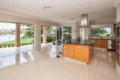 Carrara QLD, 4211 This prestige home enjoys a separate two bedroom guest residence, swimming pool, floodlit championship tennis court, helipad and 75 meter river frontage across the Nerang River to The Royal Pines Resort with sweeping 200 degree north-east views. Celebrity House is only ten minutes from Pacific Fair on Queensland's Gold Coast and the beaches of Surfers Paradise. Set on two prime acres on two titles, this expansive home of 100 squares now exquisitely reappointed, offers an idyllic waterfront lifestyle with direct Broadwater access and the freedom of absolute privacy for a large family & their guests.