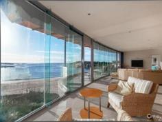 52 Kingsley Dr Boat Harbour NSW 2316 Seaside Opulence...Lashings of Luxury & Lifestyle Benefits! Handsomely positioned on an absolute beachfront block is this stunning, much admired Architect designed home that offers an amazing lifestyle opportunity, with a seamless blend of sophistication, style and comfort. This sprawling home, spread over three levels, offers a floor plan that promotes not only great separation of living, but also is built to absolutely maximise its idyllic location and showcase its picture-postcard vista. Complete with four bedrooms and office (or 5th bedroom), three bathrooms plus a powder room, designer kitchen on entry level and second kitchen on lower level, multiple living areas, office, alfresco entertaining areas, triple lock up garage with storage, and first-class fixtures and fittings throughout, combined with a cutting-edge design in complete synchronicity with its magnificent surrounds...this home truly shines. There is a plethora of features, some obvious, some subtle, that all enhance to the home's overall liveability, comfort and aesthetic appeal, these include: a grand entry with flowing water feature that runs from outside to inside, raked ceilings, tasteful use of timber panelling to add warmth, floor to ceiling glass to display the breathtaking views and invite in light, an opulent two-person round spa bath in main bedroom, stone benches, Miele appliances in kitchen, vacuumaid, state-of-the-art security system including coded entry at front gate, and much more...the calibre of this home is reflected in the paramount attention to every little detail. The floor plan lends itself to parents living on ground floor, children upstairs, and teenagers/guests/extended family downstairs. Both the upstairs and downstairs living areas have wet bars, and the lower and entry level have alfresco entertaining spaces also, including a BBQ area at rear - a cosy spot if it's windy for extra shelter. Located in a breathtaking naturally beautiful region of the NSW coast, the Port Stephens area including the lush Tomaree National Park, this home could suit an investor looking for a luxury holiday home to rent out when not being needed for personal use, an executive family working within commuting distance, wanting a haven when they get home away from the 'hustle and bustle' of urban life, or even retirees from a capital city, not yet ready for a retirement village, looking for low maintenance living, a 'sea change' with room for children and grandchildren to visit. Watch the whales migrate, fish, swim, take leisurely walks, snap stunning photographs...do whatever you please, in this world-class location that would be hard to beat, by any standard. Simply bellissimo! Interest in this property will be strong, attracting attention nationwide and internationally. Make sure you register your interest immediately or you may miss out on your opportunity to own this slice of seaside paradise.