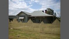 15 Sladen St East Henty NSW 2658 Federation Cottage - Fully Renovated & Extended Very neat 3 bedroom, 2 Bathroom fully renovated cottage on a large block. House has been re-stumped, painted throughout. Gourmet kitchen featuring Falcon Stove with 4 burner gas top, & wok burner, plate warmer, island bench with sink & soft-touch pantry cupboards. House is cooled by ducted refrigerated air-conditioning and heated with ducted natural gas. Property has rear access with a large two vehicle garage plus parking. Ideally located within walking distance to shops, schools and train station. 40 Minutes to Albury and Wagga, and daily train services to Albury, Wagga, Melbourne & Sydney. Henty is well serviced with schools, local hospital, aged care and sporting facilities. General Features Property Type: House Bedrooms: 3 Bathrooms: 2 Land Size: 1200 m² (approx) Indoor Features Ensuite: 1 Living Areas: 1 Toilets: 2 Gas Heating Ducted Heating Ducted Cooling Air Conditioning Outdoor Features Secure Parking Garage Spaces: 1 Deck Shed Fully Fenced Other Features Close to Schools,Close to Shops,Close to Transport,Garden,Secure Parking,Polished Timber Floor