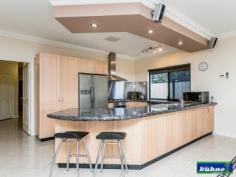 4 Kemp Pl Morley WA 6062 GRAND HOME OPEN SUNDAY 28th 12.00 to 12.45 A stunning home, designed and finished to the highest standard! This immaculately presented 4 bedroom, 2 bathroom home is full of all the (I wants). As you walk through the entry you will find yourself surrounded by beautiful ornate ceilings with quality fixings and furnishings throughout. The master bedroom with walk in robe has an ensuite which was designed way before it's time with floor to ceiling tiles and is very luxurious. The 2nd & 3rd bedrooms offer ample room and have built in robes. The 4th bedroom is currently being used as the entertainment room with built in cabinetry and block out blinds. The family bathroom also offers floor to ceiling tiles and is a modern master piece. As you enter in to the dining, kitchen and family areas which are open plan you look out over the stunning poolside retreat and patio areas, through glass sliding doors and windows that have all been furnished with ultra-chic roller blinds. The kitchen has been designed with a lot of thought for the astute cook and will simply take your breath away with its stone bench tops, top of the range appliances, dishwasher and design. This kitchen will be the envy of your friends. The reverse cycle ducted heating and cooling will keep you comfortable all year round as will the comfort of knowing the home is well secure with security doors and alarm system. As you step through the back sliding door under the huge gabled patio you will find yourself in your own little resort. The outdoor bar/ kitchen will be used year round as you sit back and watch the kids play in the heated sparkling pool in summer or the spa in winter or listening to the water features that surround the pool.