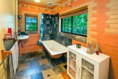 20 Bailey Street Repton NSW 2454 Unique, Peaceful and Leafy This two storey brick home is located in a quiet leafy street in Repton with access to the Bellinger River only 150 metres away! The solid two bedroom home features internal brick walls, a spiral staircase, polished timber floorboards and leadlight windows throughout. Upstairs you will find the functional timber kitchen with a bay window and gas stove/oven. Also, a comfortable lounge room with access to the verandah, reverse cycle air conditioning and a slow combustion fireplace will keep your home warm in the cooler months. Downstairs are the two good sized bedrooms with ceiling fans, a study hutch and laundry with second toilet. Step outside onto your wide verandah that wraps around the entire home which will be great for entertaining or chasing the sun! A child friendly fenced back yard with rear lane access and paved landscaped surrounds complete the picture on this desirable home. Located a short 5 minute's drive to North Beach in the quaint town of Mylestom and 22 minutes to Coffs Harbour airport, this cosy and unique home in a great location is on offer for you. Two storey, 2 bedroom brick home General Features Property Type: House Bedrooms: 2 Bathrooms: 1 Land Size: 398 m² (approx) Outdoor Features Garage Spaces: 1