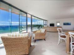 52 Kingsley Dr Boat Harbour NSW 2316 Seaside Opulence...Lashings of Luxury & Lifestyle Benefits! Handsomely positioned on an absolute beachfront block is this stunning, much admired Architect designed home that offers an amazing lifestyle opportunity, with a seamless blend of sophistication, style and comfort. This sprawling home, spread over three levels, offers a floor plan that promotes not only great separation of living, but also is built to absolutely maximise its idyllic location and showcase its picture-postcard vista. Complete with four bedrooms and office (or 5th bedroom), three bathrooms plus a powder room, designer kitchen on entry level and second kitchen on lower level, multiple living areas, office, alfresco entertaining areas, triple lock up garage with storage, and first-class fixtures and fittings throughout, combined with a cutting-edge design in complete synchronicity with its magnificent surrounds...this home truly shines. There is a plethora of features, some obvious, some subtle, that all enhance to the home's overall liveability, comfort and aesthetic appeal, these include: a grand entry with flowing water feature that runs from outside to inside, raked ceilings, tasteful use of timber panelling to add warmth, floor to ceiling glass to display the breathtaking views and invite in light, an opulent two-person round spa bath in main bedroom, stone benches, Miele appliances in kitchen, vacuumaid, state-of-the-art security system including coded entry at front gate, and much more...the calibre of this home is reflected in the paramount attention to every little detail. The floor plan lends itself to parents living on ground floor, children upstairs, and teenagers/guests/extended family downstairs. Both the upstairs and downstairs living areas have wet bars, and the lower and entry level have alfresco entertaining spaces also, including a BBQ area at rear - a cosy spot if it's windy for extra shelter. Located in a breathtaking naturally beautiful region of the NSW coast, the Port Stephens area including the lush Tomaree National Park, this home could suit an investor looking for a luxury holiday home to rent out when not being needed for personal use, an executive family working within commuting distance, wanting a haven when they get home away from the 'hustle and bustle' of urban life, or even retirees from a capital city, not yet ready for a retirement village, looking for low maintenance living, a 'sea change' with room for children and grandchildren to visit. Watch the whales migrate, fish, swim, take leisurely walks, snap stunning photographs...do whatever you please, in this world-class location that would be hard to beat, by any standard. Simply bellissimo! Interest in this property will be strong, attracting attention nationwide and internationally. Make sure you register your interest immediately or you may miss out on your opportunity to own this slice of seaside paradise.