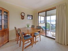 913 Oceana Dr Tranmere TAS 7018 Whale Of a Time Near the Water Land area: Approx 150m2 inc garage/workshop Land area: Approx 880m2 Offers around $415,000 SWEEPING views across the River Derwent to the city and Mt Wellington enhance this well presented, split-level family home with lovely mature gardens. Designed to maximize the outlook and sun through the day, the home is located in an established, harbour-side suburb on Hobart's eastern shore. The good sized block is very gently sloping with a cement driveway down to the under-house garage/workshop with a roller door and a single carport before the rear garden with its veggie plot and glass-house. A side porch-way provides access to a foyer with a terra cotta tile floor and a sliding door to the bright lounge with a Daikin air conditioner and the delightful views across the sparkling blue river. Adjoining is a dining area with a sliding door to a cosy sunroom and adjacent sundeck with harbour views. Also off the dining area is a functional Blackwood kitchen with good bench and cupboard space and including an upright stove with a ceramic cook-top and oven/grill, a stainless steel range-hood and there's a dishwasher. Two steps down is a family room with a storage heater and then a short hallway with a panel heater and linen press before three bedrooms with built-in storage and the master also having an en suite bathroom. The family bathroom is nearby and includes a toilet, while the laundry, with another handy loo off, is located to the rear of the garage and there also is good under-house storage. The property is close to transport and is about a10 minute drive from the schools, shops and other services at Howrah while the city centre is about 20 minutes by car. There are pleasant river-side walks in the area while yachts and other river traffic, porpoises and very occasionally whales provide an entertaining outlook from the living areas and deck. Property Snapshot Property Type: House Aspect Views: Harbour, City and Mountain Views House Size: 150.00 m2 Land Area: 880 m2 Features: Decking