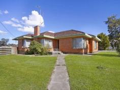 1 Collins St Kangaroo Flat VIC 3555 On a corner allotment of over 1000 square metres, there are many options for the new purchaser of this brick veneer home. But
if you want a slower paced lifestyle, where the kids can walk to and
from school, both primary and secondary, and your weekly shop can be
done without you having to get the car out, and then this is the ideal
buy. It's handy to everything including public transport at the front
door. The home is full of natural light, and has a first-class
kitchen with up to date appliances. There's plenty of storage space and a
family gathering' feel to it. Polished boards lead to the bedrooms and lounge, while the busy areas, laundry and hallway to the back door has been tiled. The home zings with fresh paint and pretty lace curtains and this adds to the sense of light and openness. Heating and cooling provide comfort through all seasons. There's a fantastic double carport plus a shed with power, concrete floor and roller door. The
garden is ideal for a green thumb, with established shrubs and lawn.
You can see the 1950s influences on the home in the wrought iron ouches
in the verandah. Explore the potential here in great location where you're just a few minutes from everything you'll need.
