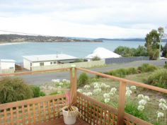 30 Carlton Bluff Road Primrose Sands TAS 7173 This brick veneer home has a spectacular
view of Primrose Sands beach and the bay from the living areas and deck.
Featuring 2 bedrooms, open plan living, 3 storage/garden sheds, outdoor living
area at the rear and a viewing deck off the lounge area. This top side of the
street home is unlikely to have its view impaired by future building. The floors
are tongue & groove Tas oak with a tiled kitchen. You want a water view? -
then you MUST inspect.