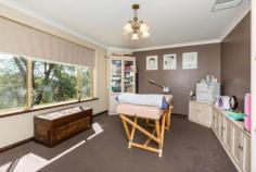 1 Crofter Ct Wellard WA 6170 PEACE AND PRIVACY ON HALF ACRE A wide inviting entry leads to formal Lounge/Dining area on the left (this is currently being used as an exercise area and beautician room) and the Master Bedroom on the right. There is a connecting door from kitchen into the dining area. The Main Bedroom is spacious with a walk-in robe and Ensuite Bathroom. A gorgeous kitchen with loads of storage, walk- in- pantry, 900mm freestanding stainless steel gas stove, rangehood, dishwasher, lighted feature overhead cupboards and miles of benchspace, overlooks the open plan meals and family living area. Off from the Living area is an Activity/Kids TV room. This an excellent idea as it creates 3 living areas to accommodate diverse family needs. Both minor bedrooms are doubles and have robe recess's and the main bathroom is centrally located to both bathrooms and the WC is a separate room. The Laundry is also in this wing of the home and has good storage as well as a sliding door out to the exterior of the home. The home has ducted evaporative air conditioning and there are 4 gas bayonet fittings. Outdoors the paved driveway affords plenty of off road parking, the carport holds 2 cars and the powered workshop has easy driveway access. This home was built in 1989 as were most of the homes in this exclusive little area at Homestead Ridge but the owners have upgraded the kitchen to create a more modern ambiance. The block is 2,618sqm which is larger than most in the area. With all facilities just minutes away, it is like living in the country but with all modern conveniences.