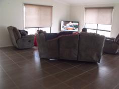 40 Raglan Street Roma Qld 4455 This opportunity is not to be missed - this one will be snapped up. Giving very little away from the street this locally built family home is an absolute must see for the home buyers and astute investors. This spacious home consists of 3 built in bedrooms (main has access to the 2 way bathroom). The tiled bathroom has vanity plus trendy shower. The great open plan living/kitchen and dining areas has wood heater, large floor tiles and evaporative air conditioning throughout. The modern kitchen consist of big pantry, electric stove, island bench, 1 1/2 bowl sink and plenty of cupboard space which adjoins the good size rear entertaining deck. Two bay lock-up car accommodation plus workshop bay (9x6), garden shed, landscaped gardens all of this in a security fenced yard. REDUCED TO $385,000