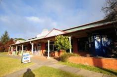 91 Hoddle Street Robertson NSW 2577 Web ID : 1667004 Price : $950,000 WIWO Property Type : House Sale : Private Treaty Land Size : 1226 Sqms Investment Opportunity! 6 2 2 Zoned B2 Local Centre constructed of brick and timber with an iron roof. Presently a General Store/Newsagency and small Gift Shop. Above the General Store/Newsagency - 2 bedroom flat with living area, kitchen and bathroom. The Gift Shop with smaller shop front features a 4 bedroom flat behind and above. Consisting of large lounge room, kitchen, laundry and utility room below and upstairs four bedrooms, bathroom and separate w/c and a wide balcony across the upstairs section. Verandah at street level, tandem style double garage (drive through). Back yard with access from laneway (at present access not legal is via the hotel adjoining driveway).