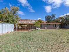 16 Forrest Crescent Gillen NT 0870 Set on a magnificent allotment of 1210sqm with glorious, uninterrupted
views of the MacDonnell Ranges in the well sought after area of Gillen,
this 4 bedroom home is the perfect way to establish you as an owner in
the Real Estate Market. Entering into the large open plan
living/ dining is quite a treat with sunlight streaming through the
large windows in the lounge room, offering a bright fresh feel. The
kitchen has been delightfully renovated including gas cook top, electric
oven, new dishwasher and there is a large space for a double fridge. The
long breakfast bar offers room to sit and enjoy the culinary delights
prepared in the large well appointed kitchen, offering plenty of bench
and cupboard space. Consisting of four carpeted bedrooms, 3 being
very spacious and the 4th being smaller that could be utilised as a
bedroom, nursery or an office. The large main bedroom has extensive
robes and access through to the two way bathroom. To keep you cool
during the hot summer months there are split system air conditioners in
two of the bedrooms and ducted air conditioning services the remainder
of the house. The backyard is massive and open, with ample room
for all the family and pets to enjoy. It includes a 3.5 x 6.5m shed, an
aviary and a garden shed There is a new double carport, plus
concreted drive way for further parking. The outside of the house has
been freshly painted and a new front fence installed.