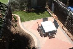 57/111 Bloomfield St Gillen NT 0870 This unit is located in the Gap Estate which is approx. 3.2kms from the town center. The complex itself has a large swimming pool to relax during the warm summer days. The two bedroom townhouse is neatly presented with open plan living area downstairs and split system air conditioning. All furniture is in good condition and includes couch, study desk, white goods and bed. Upstairs there are two bedrooms with built-ins and split system air conditioning. The second bedroom has a balcony with views of the ranges. The bathroom has shower, toilet and vanity. Downstairs you have a private courtyard that is beautifully designed with paving, artificial grass and a garden bed. A great place to have BBQ while you enjoy the views of the ranges. Undercover parking out the front and only side neighbours is very appealing.
