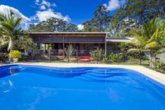 261 Mardells Rd Bucca NSW 2450 The Complete Package This beautiful property located in Bucca, just a short 10 minute drive to Coffs Harbour, Moonee, beaches and restaurants. This home oozes with the characteristics of yesteryear, combine this with all the mod cons that you would expect along with numerous sheds and outdoor entertaining areas, beautiful lawns and gardens and of course a sparkling in ground swimming pool and you have the perfect property. The home has 3 large bedrooms all with built in robes and ceiling fans, the main has access to a 2 way bathroom. The galley style kitchen features gas appliances with plenty of bench and cupboard space. There is a large formal dining room; easily converted to a 4th bedroom if required and large lounge room with fireplace, featuring beautiful timber bi fold doors that lead onto one of the large undercover outdoor areas. This is the perfect place to relax overlooking the meticulously maintained grounds and sparkling in ground swimming pool. This property is private from the outside world and yet only minutes to town, the best of both worlds! Other features of this property are; * Bore with a flow rate of approx 9,000 litres hr * 6m X 9m 2 bay garage. General Features Property Type: Acreage/Semi-Rural Bedrooms: 3 Bathrooms: 1 Land Size: 0.60ha (1.49 acres) (approx) Outdoor Features Carport Spaces: 1 Garage Spaces: 5