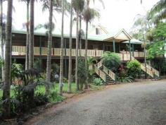 1227 Teven Rd Alstonville NSW 2477 ALSTONVILLE MANSION - OFFERS PLEASE ALL OFFERS CONSIDERED - OWNER WANTS TO MOVE NORTH. This very grand Federation home which is set on a level 5.242 acres of land and only a few minutes drive into Alstonville Village. Entering through the front door you will be surprised by the high ceilings & spacious foyer. Comprising of eight bedrooms, five bathrooms, two kitchens & four living areas this beautiful home is now ready for a new family to appreciate, update and enjoy the space and surroundings. The ground floor has a spacious living area, kitchen, separate dining and family bathroom plus a single lock-up garage. Upstairs, a large timber kitchen & combined family room, formal dining, lounge & separate living or study. The third level has a loft bedroom with own bathroom. A large deck surrounds the upstairs living with impressive entry stairs and rear stairs. An extremely large shed with cool room plus an additional shed with a two bedroom studio. Garaging for at least six vehicles in the main shed if required. Subject to council approval this property would be perfect for a Bed & Breakfast Establishment or for the large extended family. Undoubtedly this home and infrastructure could not be replaced for the asking negotiated price. Take advantage of the low interest rates. Exceptional value.