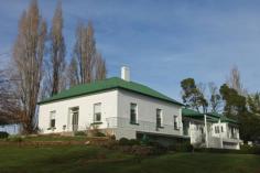 5283 Bass Hwy Deloraine TAS 7304 Classic Country Homestead with a Twist Set on ten lush acres of prime soil for grazing sits this extra-large country residence. The original Georgian style period home Hilltop was built in 1847 with the large additional wing being added in the 1950’s and matches in beautifully with the original homestead. Large and spacious the home consists of 4 to 5 bedrooms, office, study, massive formal living room, sitting room, updated main bathroom with additional bathroom and kitchen ideal for guests, large open plan main country kitchen, double garage with remote access under as well as twin cellars. Out buildings are a plenty here to with three bay vehicle/implement garaging with a joining storage/workshop, an old dairy that has been converted into stables, large barn and poultry run. The beautiful gardens are full of colour in spring and the property is around the home has been planted out with many old well established exotic trees, English box hedges and shrubs adorn the home and the majestic driveway is lined with large vibrant poplar trees. This fantastic lifestyle property would be Ideal for the extended family looking for a tree change or would be easily and ideally converted to a guest house/B&B (STCA). All this and so much more located just five minutes’ drive to the beautiful tourist town of Deloraine where all major services are available and only forty minutes to either Launceston City to the North or Devonport City to the West. Inspections strictly by appointment only, to move forward with yours call me now.