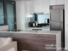 10701 8 Harbour Rd HAMILTON Qld 4007 This spacious 2 bedroom, seventh floor apartment overlooking Hamilton and Eagle Farm Race Track really does have it all. This floor plan has a beautiful open plan layout with large living and dining area that is accentuated by the double glazed floor to ceiling doors embracing the morning sun. The modern kitchen is equipped with European appliances - gas cook top, electric oven and dishwasher plus plenty of bench and cupboard space has direct access to the balcony making it perfect for dining and entertaining with ease. The master bedroom has a separate ensuite, with the second bedroom boasting views up the Brisbane River. Both of which are queen sized. The laundry is cleverly hidden behind closed doors and the main bathroom includes a bath tub for complete relaxation. This is a Pet friendly complex. Located in the hub of the Hamilton Harbour Precinct and 3 minutes walk to Racecourse Rd Village, Brett's Wharf and Portside, you will be in the centre of all the local dining, entertainment, shopping, medical and community services. Close to a variety of public transport options including the BCC City-cat and ferries, trains, bus stops, airports and arterial roads, going places is a breeze.
