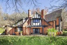 174 Oxley Dr Mittagong NSW 2575 Web ID : 1650065 Price : $2,990,000 Property Type : House Sale : Private Treaty Land Size : 3 Acres Woodland garden estate in picture book setting 4 4 2 Redlands' is a glorious woodland garden estate featuring a regal Tudor style manor as its gracious centrepiece. Set on 1.2 hectares (3 acres) of magnificent grounds, the property enjoys an idyllic picture book setting a short drive to Bowral and Mittagong town centres. Micro-climate gardens with Paul Sorensen design trademarks Rare and exotic trees, meandering pathways, dry stone walls Previously renovated residence with scope to enhance further Grandly proportioned interiors enjoy private, leafy outlooks Formal reception areas plus spacious open plan family room Gourmet kitchen with prestige appliances and walk-in pantry Four double sized bedrooms, three with ensuite Hydronic heating, timber floors, alarm and cellar/storage Automatic double lock-up garage with direct internal access Short drive to Bowral and less than 90 minutes to Sydney. Property Features Alarm SystemBuilt-In WardrobesFireplace(s)GardenSecure ParkingPolished Timber FloorFormal LoungeSeparate DiningHydronic heating