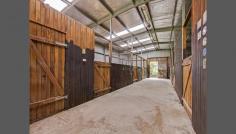 Exceptional Facilities For The Horse Enthusiast Commanding captivating rural and mountain views this magnificent 10 acres provides lush arable pasture and an abundant water supply with bore and large dam. Exceptional facilities for the horse enthusiast include 60 x 40m Olympic sized sand arena, round yard, large stable complex with concrete flooring, tack and feed room plus multiple paddocks with post and rail fencing. The character filled residence is surrounded by approx. 1 1/2 acres of beautiful gardens with 3 port Jackson Figs that provide a wonderful shade canopy on the western side of the house. Features: Wide entry foyer, high ceilings and formal lounge with cosy S/C fireplace Spacious family room with split system A/C, French doors and picture windows Light filled country kitchen with timber bench tops and leadlight display cabinets Miele dishwasher, large gas cooktop, electric oven and walk in pantry Huge master bedroom with large WIR, and ensuite with separate toilet 3 additional double sized bedrooms with BIRs and huge laundry/utilities room Fabulous paved outdoor pergola area with original well Private entrance gates, plenty of off street parking and separate double garaging Horse Facilities: Separate access road with blue metal base to large stable complex and 60 x 40m Olympic sized arena with sprinkler system and fencing Stable complex with 4 regular sized boxes and 2 oversized warm blood boxes, wide central alley with electricity for grooming, lockable tack room with shelving and electricity, bridge hooks and saddle racks, massive feed room, float bay and tractor bay and 2 separate entrances with concrete aprons Approx. 5 acres (4 paddocks) with post and rail fencing and water in each yard Extra wide alleys between paddocks and perimeter fence to access large dam